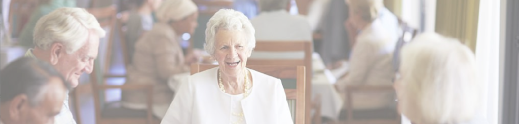 Residents enjoying a group activity in the common dining area at Mallards Landing